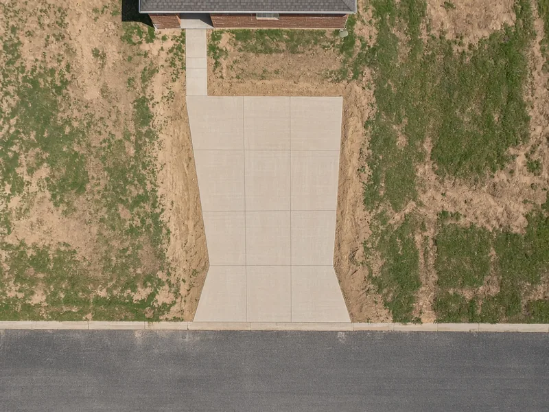 Overhead view of a new two-car driveway flaring to the street gutter, Clyde, TX